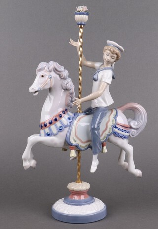 A Lladro porcelain figure, Boy on Carousel Horse 1470 38cm h