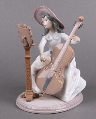 A Lladro porcelain figure, Concerto 6332, girl playing a cello, 16cm 