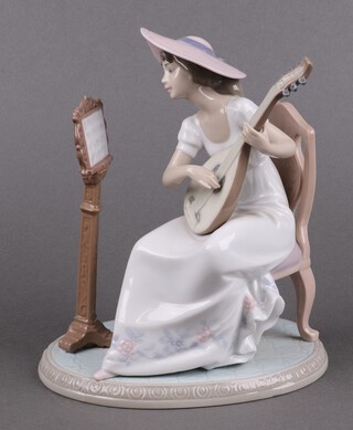 A Lladro porcelain figure, Sweet Song 6408, girl playing a lute 18cm