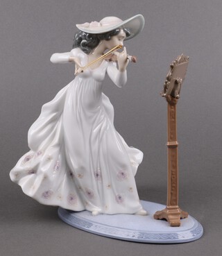 A Lladro porcelain figure, Symphony 6243, girl playing a violin 21cm 