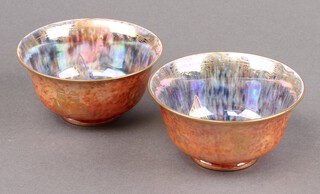 A pair of Wedgwood Fairyland lustre bowls decorated butterflies and musical instruments, the base marked Z4825 