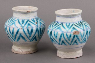 A pair of 19th/20th Century blue and white glazed Isnic pottery vases 14cm 