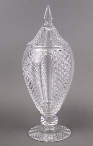 A large and impressive cut glass urn and cover, raised on a circular spreading foot 46cm 