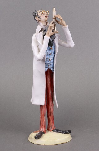 An Italian pottery figure of a standing doctor with syringe 31cm 