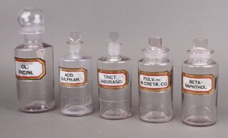 Five 19th Century clear glass Pharmacy bottles - OL:Ricni (chip to lid), Beta-Naphthol (chip to stopper), PULV:proM:Cretae.Co, Acid Sulph:AR:, Tinct:Jaborand  