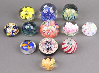 Two Perthshire glass paperweights together with 10 others 