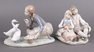 Two Lladro porcelain figures, Friendship 1230 13cm and Food for Ducks 4849 15cm 
