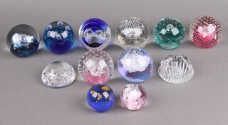 Nine Caithness paperweights with certificates - Cauldron, Quick Silver, Spinaway, Sirocco Silver Rain, Jumping for Joy, Pink Champagne all 7cm, Pixie and Moon Crystal 4cm together with a Stewart paperweight engraved a salmon and 2 others 