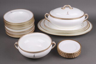A 22 piece Mintons white and gilt banded dinner service with Winter armorial, retailed by Philips of Oxford Street comprising 3 oval meat plates, twin handled tureen and cover, 8 soup bowls (1 rings flat), 8 dinner plates, twin handled tureen and together with 8 Tuscan white and gilt banded tea plates manufactured for Harrods 