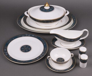 A 47 piece Royal Doulton Carlyle pattern dinner service comprising large oval meat plate (second), small oval meat plate, twin handled tureen and cover, sauce boat and stand, salt and pepper, 8 dinner plates, 8 tea plates, 8 twin handled soup bowls and saucers 