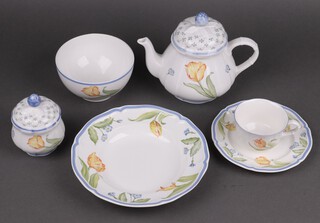 An 85 piece Villeroy & Boch Tulip pattern dinner service comprising oval meat plate, 9 dinner plates (3 chipped, 2 ring flat), 8 soup bowls, 6 side plates, 8 tea plates, 8 pudding bowls, teapot, milk jug and sugar bowl, 7 cups, 7 saucers, 6 breakfast cups, 8 saucers, 6 mugs and 8 bowls 