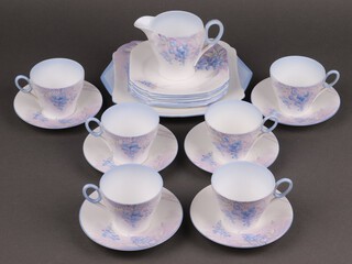 A Shelley 20 piece Wisteria pattern tea service comprising twin handled bread plate, 6 square plates, cream jug, 6 cups (3 ring flat) and 6 saucers, bases marked C.12429 