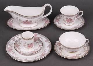 A 74 piece Royal Doulton Canton pattern tea/dinner service comprising 8 dinner plates, 8 side plates, 16 tea plates, sauce boat and stand, 8 twin handled soup bowls, 8 tea cups, 8 saucers, 8 coffee cups, 8 saucers 