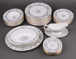 A 39 piece Royal Worcester Mayfield pattern dinner service comprising oval plate, 2 oval bowls, sauce boat and stand, 12 dinner plates, 8 soup bowls, 8 side plates, 8 tea plates (1 rings flat) 