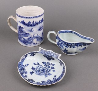 An 18th Century Chinese export porcelain blue and white tankard decorated willow pattern (handle has old restoration, the top has 2 chips and is cracked) together with a Chinese blue and white scallop shaped dish 16cm (chip to side and handle) and a Chinese blue and white porcelain sauce boat 17cm (handle is cracked) 