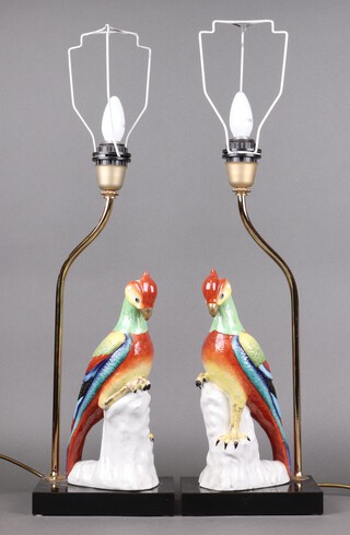 Giulia Mangani,  pair of Italian porcelain table lamps in the form of a parrots, raised on ebonised bases 34cm 