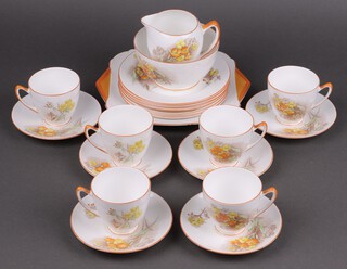 A 21 piece Shelley primrose decorated tea service comprising twin handled cake plate, 6 tea plates, cream jug (rings flat), 6 cups and 6 saucers (1 rings flat) 
