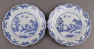 A pair of 18th Century Chinese blue and white plates with wavy borders, decorated figures 23cm 