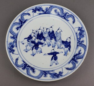 A 19th Century Chinese blue and white porcelain plate with dragon border decorated figures 31cm 