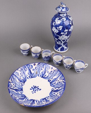 A 19th Century blue and white Chinese urn and cover, the base with 4 character mark 30cm (chips in places) together with 6 18th Century Chinese blue and white cups with landscape decoration and a circular Delft bowl 28cm 