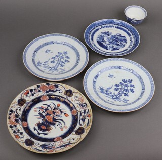 A Chinese blue and white tea bowl the base with 6 character mark 6cm, a Chinese blue and white 19th Century Willow pattern plate 20cm, a pair of late 18th to early 19th Century Chinese blue and white plates decorated storks 22cm (1 with crack) and a Japanese Imari porcelain plate 14cm 