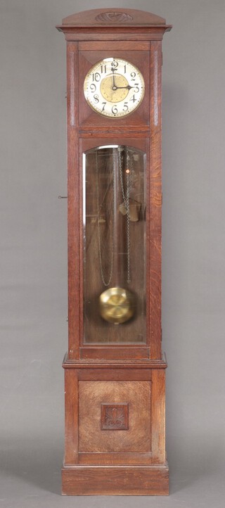 An Edwardian German longcase clock with 26cm circular dial, silvered chapter ring and Roman numerals, contained in an oak case 214cm h x 29cm w x 50cm d 