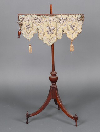 A 19th Century mahogany pole screen with shaped banner on a pillar and tripod base 90cm h 