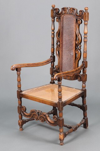 A 17th Century style turned and carved beech open arm chair with woven cane seat and back, raised on turned supports with H framed stretcher 120cm h x 58cm w x 54cm d (a/f, signs of old but treated worm)