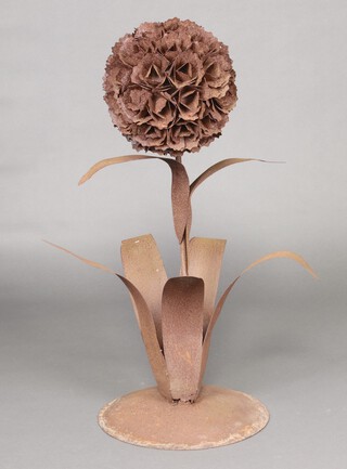 A rusted steel garden ornament in the form of an allium 94cm h x 42cm w