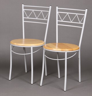 A pair of Malaysian grey painted tubular metal and beech framed chairs 