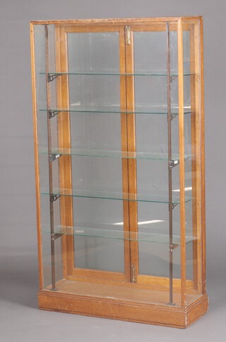 An oak shop display cabinet fitted adjustable shelves, 167cm h x 91cm wide x 30cm d 