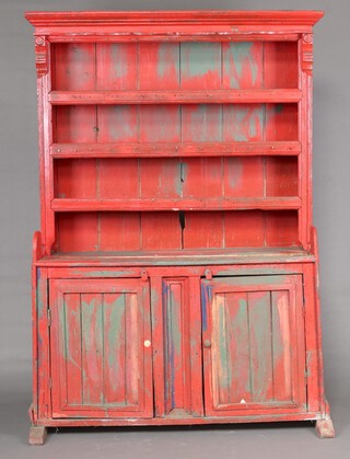 A 19th Century red painted Irish dresser with moulded cornice, the raised back fitted shelves above a cupboard enclosed by panelled doors, 200cm h x 134cm w x 54cm d (signs of old but treated worm  in places, split to the side) 