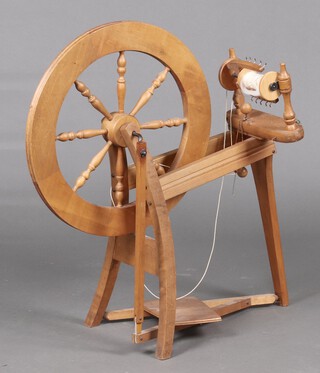 Ashford, a New Zealand beech spinning wheel complete with attachments 86cm h x 71cm w x 35cm d 