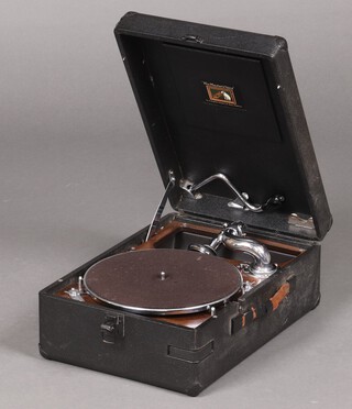 A HMV portable gramophone contained a black fibre case, complete with a gramophone record 