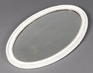 An Edwardian oval bevelled plate mirror contained in a white painted frame 74cm h x 49cm w  