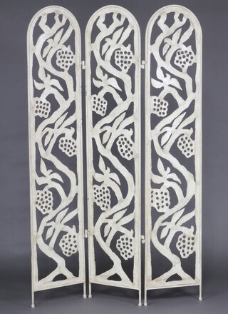 An arch shaped pierced and pressed metal 3 fold screen decorated birds, 118cm h 