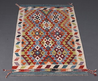A white, green and orange ground Chobi Kilim rug 130cm x 83cm 