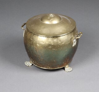A cylindrical polished brass twin handled coal bin on paw feet (slight crack to side)