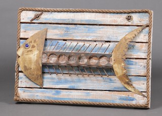 A recycled wall art plaque in the form of a fish, formed from "drift wood", nails and metal 54cm h x 73cm w 