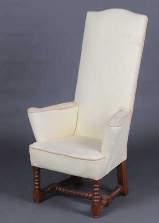 A Queen Anne style high back armchair upholstered in yellow material, raised on turned supports with H framed stretcher, some staining to upholstery 
