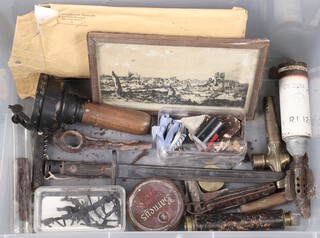 A hand bearing compass, a cut down World War One bayonet, a section of barbwire and various other World War One and later curios, contained in a plastic box