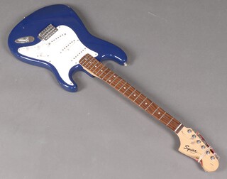 A Squier Strat electric guitar 