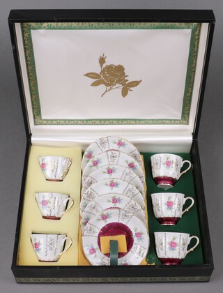 A 12 piece Continental porcelain coffee set - 6 cups, 6 saucers, cased