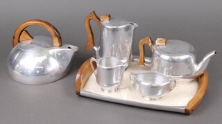 A collection of Picquot ware including a kettle the base marked K3, twin handled tea tray  and a 3 piece tea service with teapot, hot water jug and cream jug 