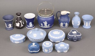 A collection of blue and white Wedgwood Jasperware including biscuit barrel and cover with silver plated mount, 3 vases, 2 club shaped vases, a jug and various trinket boxes, ashtrays, pin trays etc 