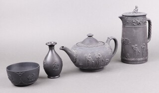 A Wedgwood black basalt jug and cover 18cm (chip to rim), a Wedgwood black basalt teapot 20cm (spout stuck), circular bowl 11cm and a small club shaped vase 13cm 