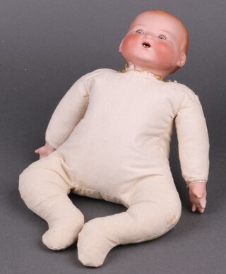 A Grace Putnam Bye-Lo doll with Armand Marseille bisque head (incised AM Germany), fully stuffed torso, arms and legs, with porcelain hands 31cm long  