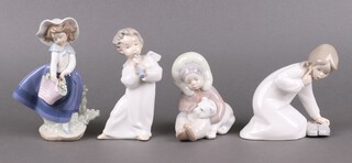 Four Lladro figures - Pretty Picking 0100522, Angel with Flute 4540 Eskimo 1195, Little Girl with Slippers 4523 