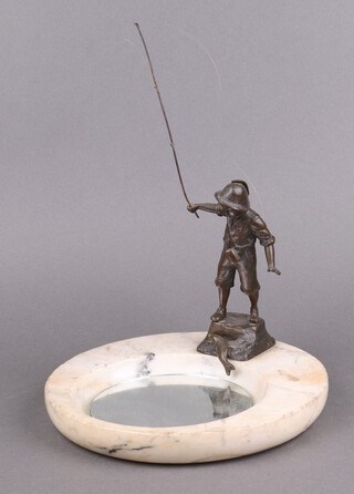 An Art Deco Continental bronze and white marble ashtray decorated a standing boy fishing with a  fish at his foot 24cm 