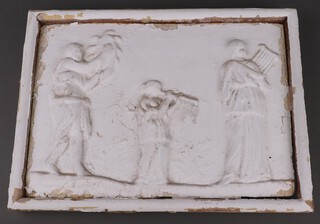 After the antique, a Parthenon style plaster wall plaque depicting musicians 30cm h x 41cm w within a wooden frame 